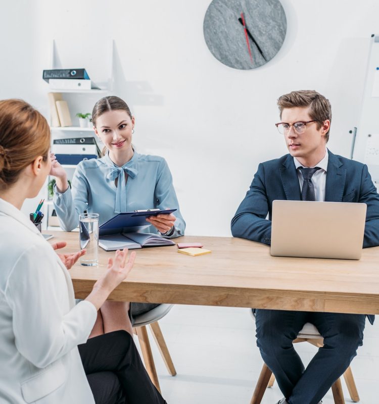 back-view-of-employee-talking-with-recruiters-on-job-interview-in-office.jpg